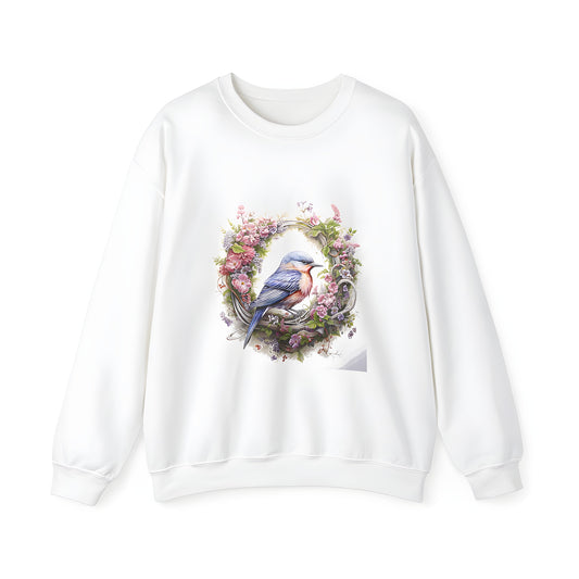 Colorful graphic adult sweatshirt featuring a vibrant bluebird perched within a wreath of colorful flowers