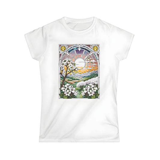 Colorful graphic t-shirt with a vibrant sunset and blooming flowers over rolling hills