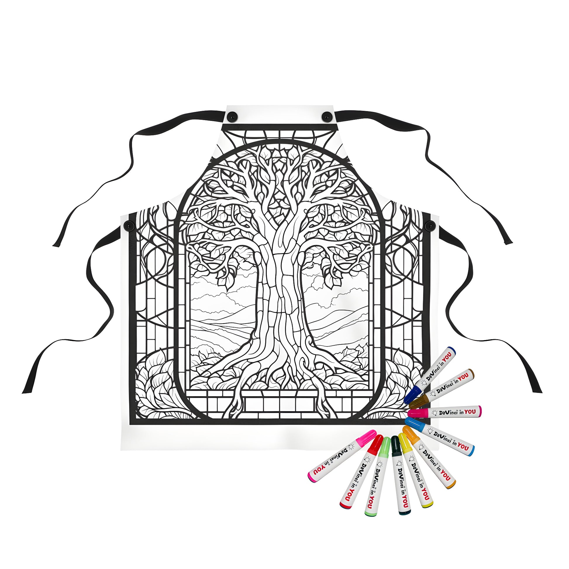 Intricate stained glass apron design featuring a large tree surrounded by leaves and branches, set against a natural landscape. Colorful and vibrant fabric markers included for a fun coloring experience.