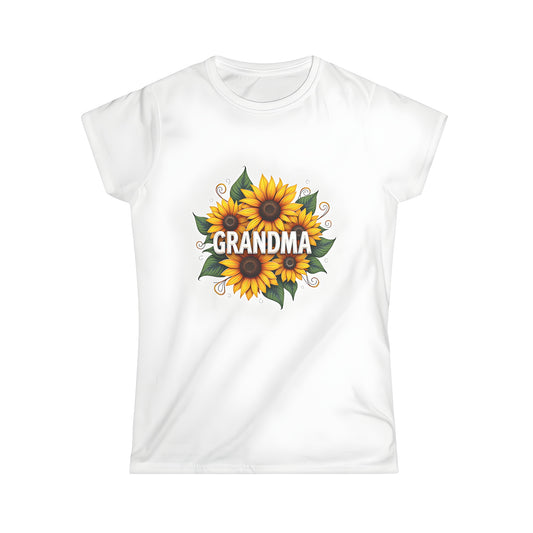 Women's t-shirt featuring a colorful graphic design of bright flowers, similar to sunflowers, with bold text 'GRANDMA' at the center. A vibrant floral arrangement for ladies.