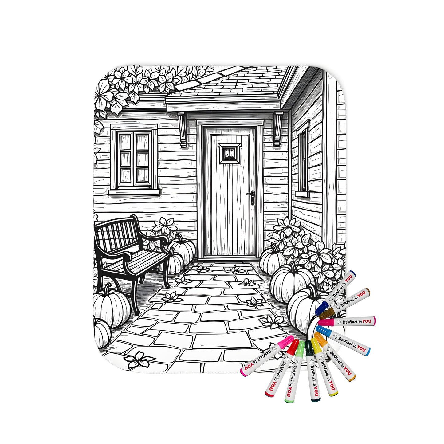 Colorful blanket featuring a charming cottage entrance scene with pumpkins and lush flowers, perfect for cozying up at home. Includes fabric markers.