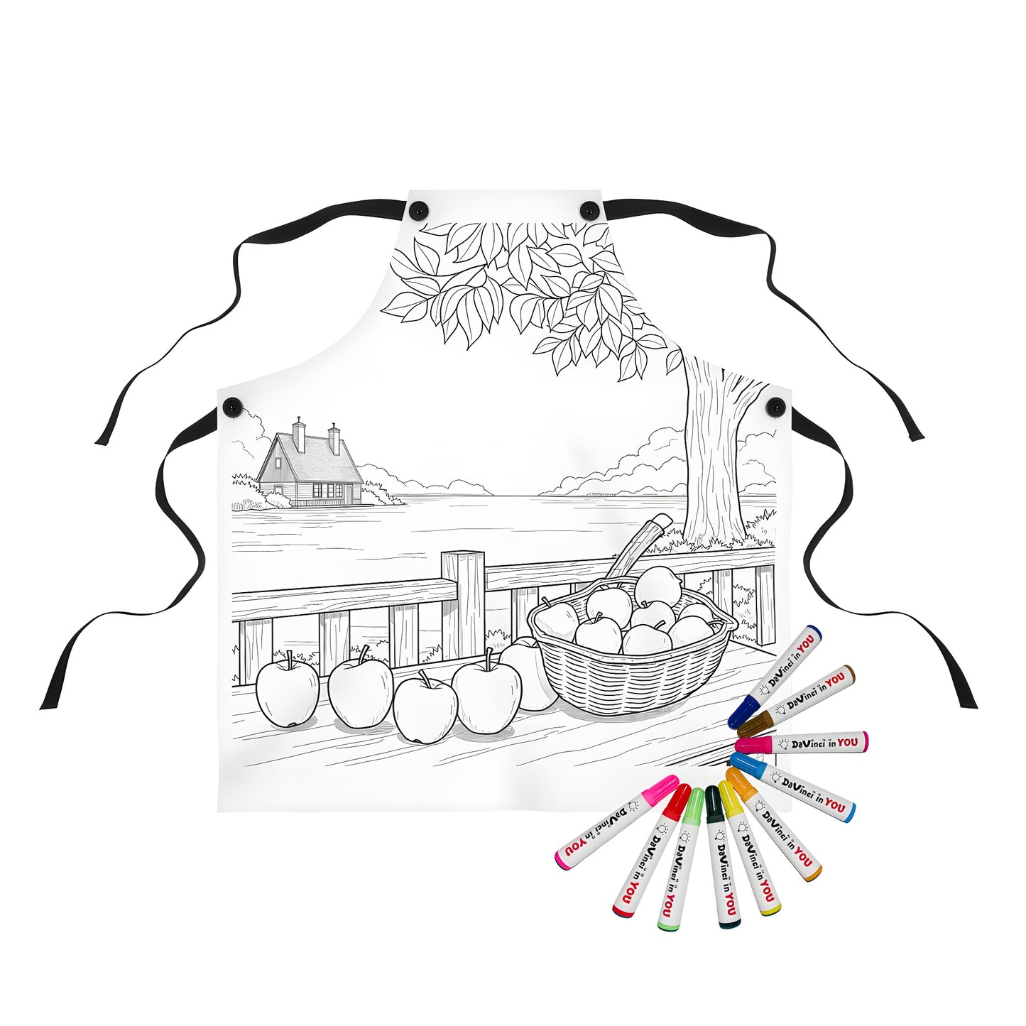 A colorful apron featuring a serene countryside scene with a basket of apples on a table overlooking a tranquil lake and house, perfect for art enthusiasts