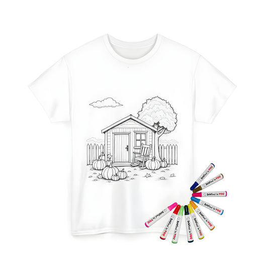 Unisex T-shirt featuring a coloring page design of a quaint cottage with pumpkins and a tree, surrounded by a picket fence, set against a cloudy sky