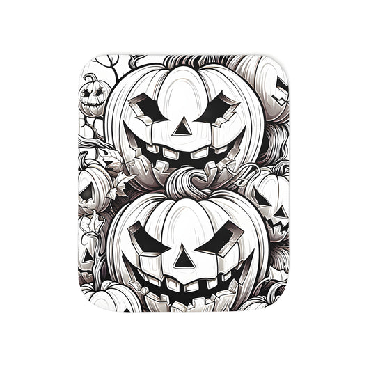 Cozy colorful graphic blanket with intricately drawn gourds, jack-o-lanterns and autumnal foliage