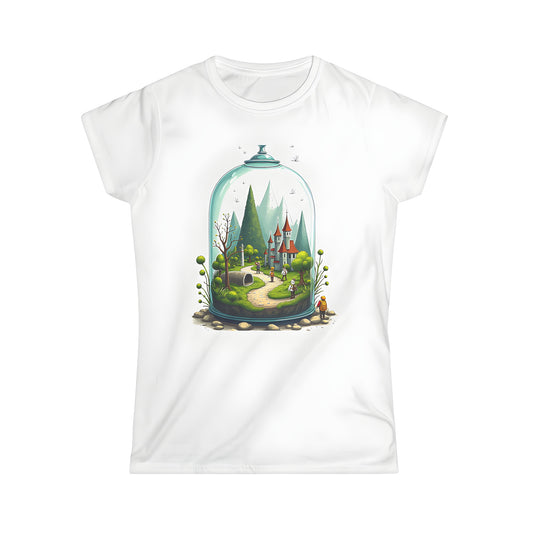 Women's t-shirt featuring a colorful graphic design of a fantasy landscape under a glass dome with a winding path, tall trees, and adventurers approaching a whimsical castle