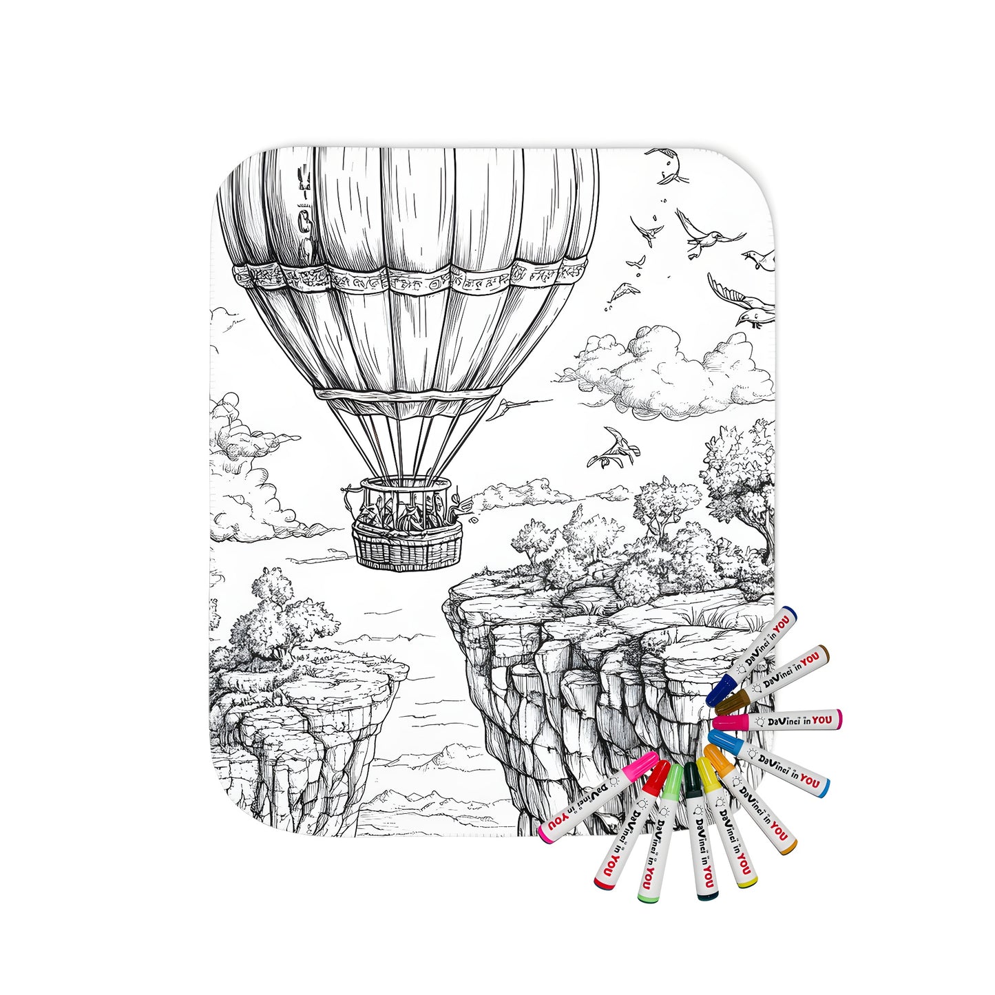 A cozy blanket featuring a vibrant hot air balloon scene soaring over a serene canyon landscape surrounded by lush trees and birds.